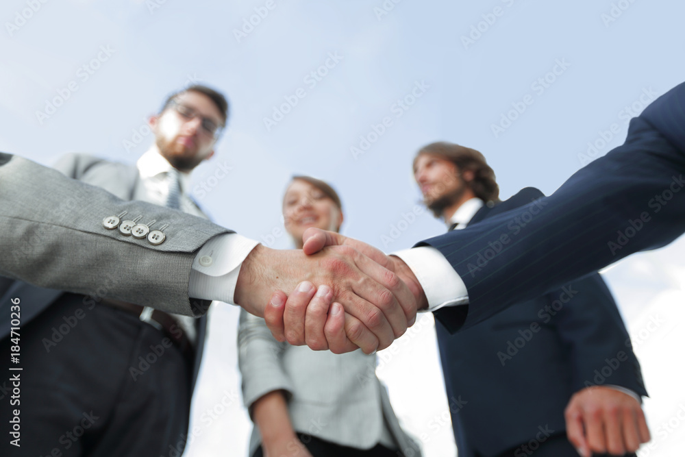 in the foreground.handshake of business partners