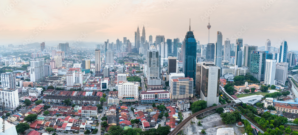 Fototapeta premium Panorama cityscape of Kuala Lumpur skyscraper with colorful sunrise sky, Malaysia.