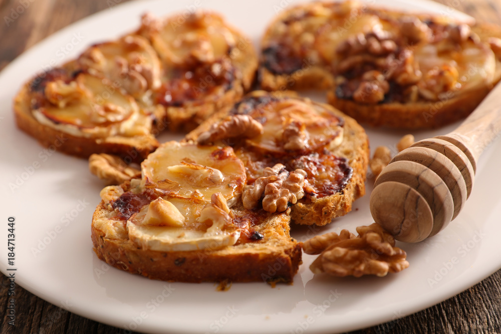 close up on bread with cheese and honey