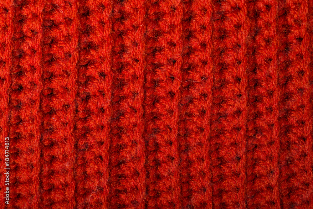 Red knitted wool texture can use as background.