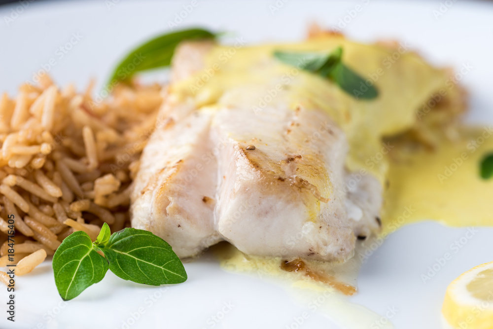 Grilled fish with rice and lemon sauce Grilled fish with rice and lemon sauce