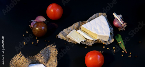 cheese brie and camembert with vegetable and spises photo