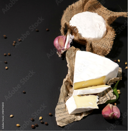 cheese brie and camembert with vegetable and spises photo