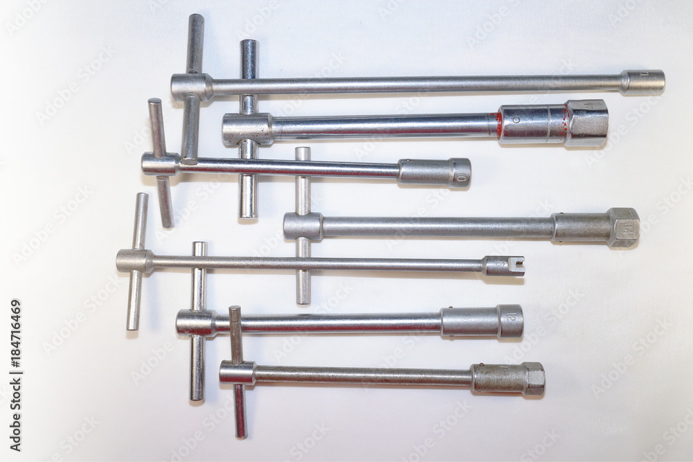 tools for work, end wrenches in different positions on a white background tools for work, end wrenches in different positions on a white background