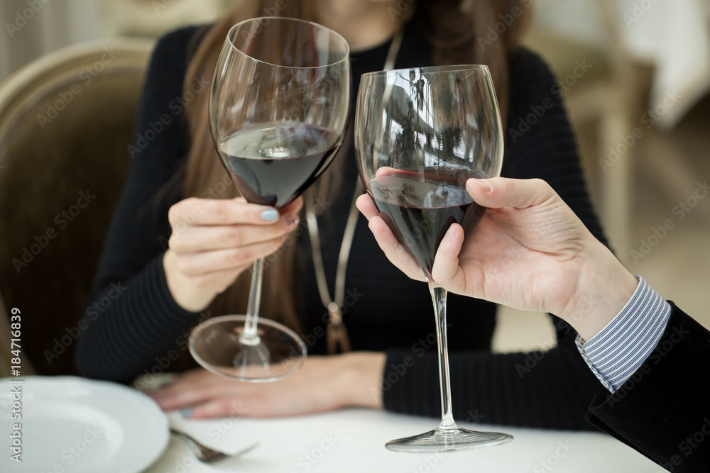 Couple toasting wineglasses Couple toasting wineglasses