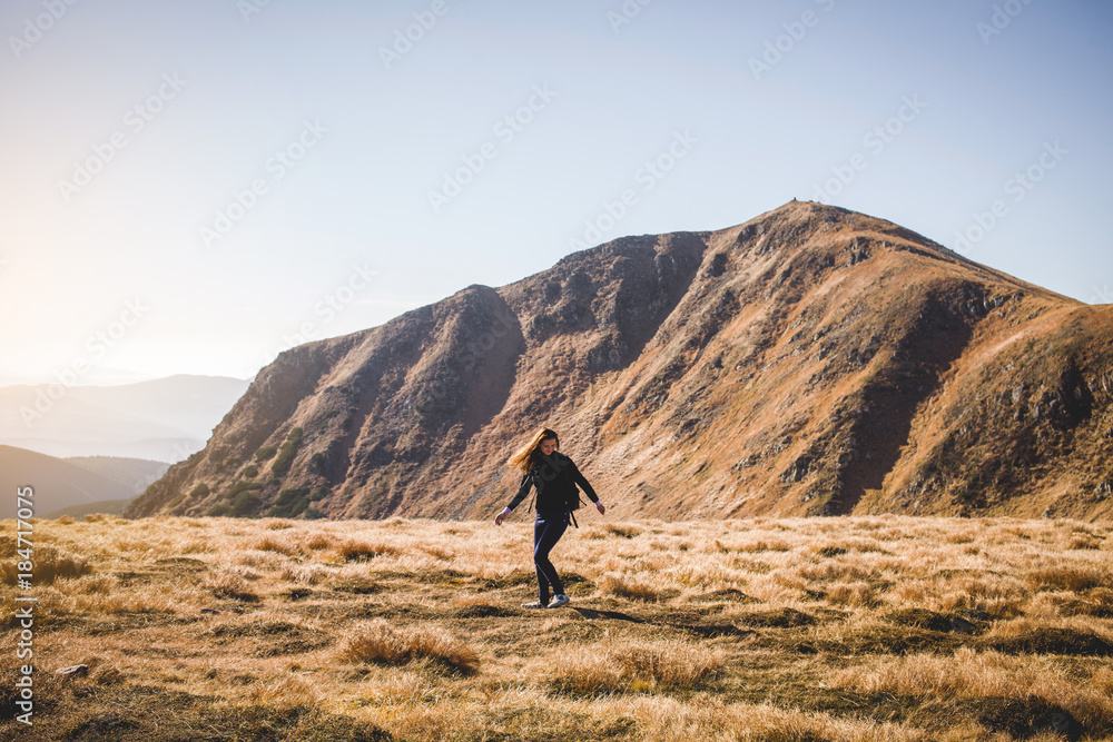 Young Girl Dancing in Beautiful Mountain Landscape