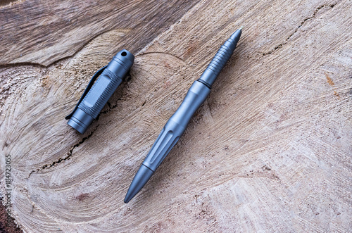 Metal ball pen on a wooden stump.