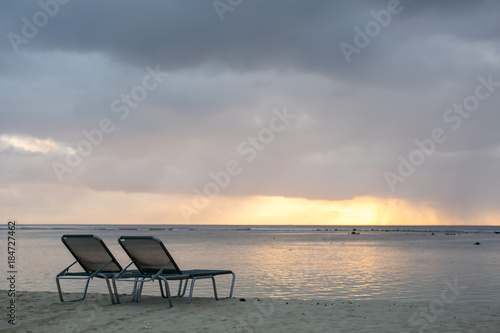 beach chair on the beach with sunset © Artem Zakharov