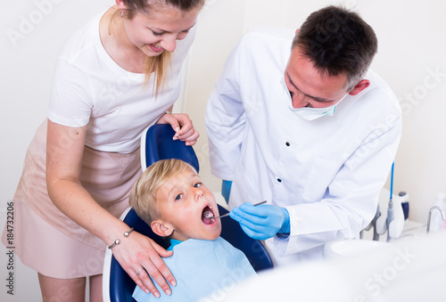 Woman with kid are visiting dentist