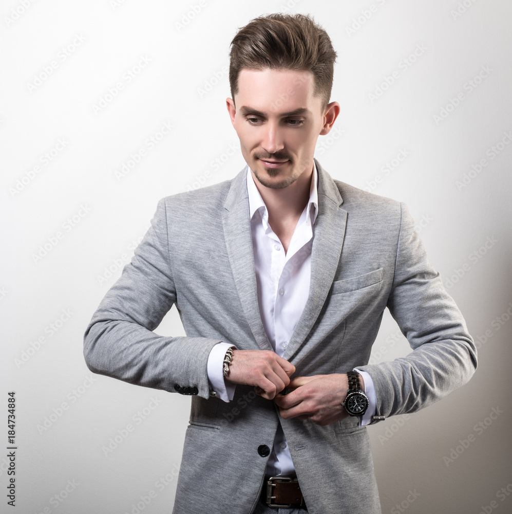 Sensual Pose Of A Young Fashion Model Wearing A Leather Jacket On Darg Gray  Background Stock Photo, Picture and Royalty Free Image. Image 90113004.