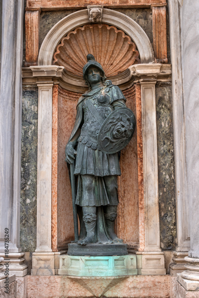 Architectural detail, a sculpture adorns the entrance to the Campanile di San Marco -bell tower of Saint Mark- Italy.