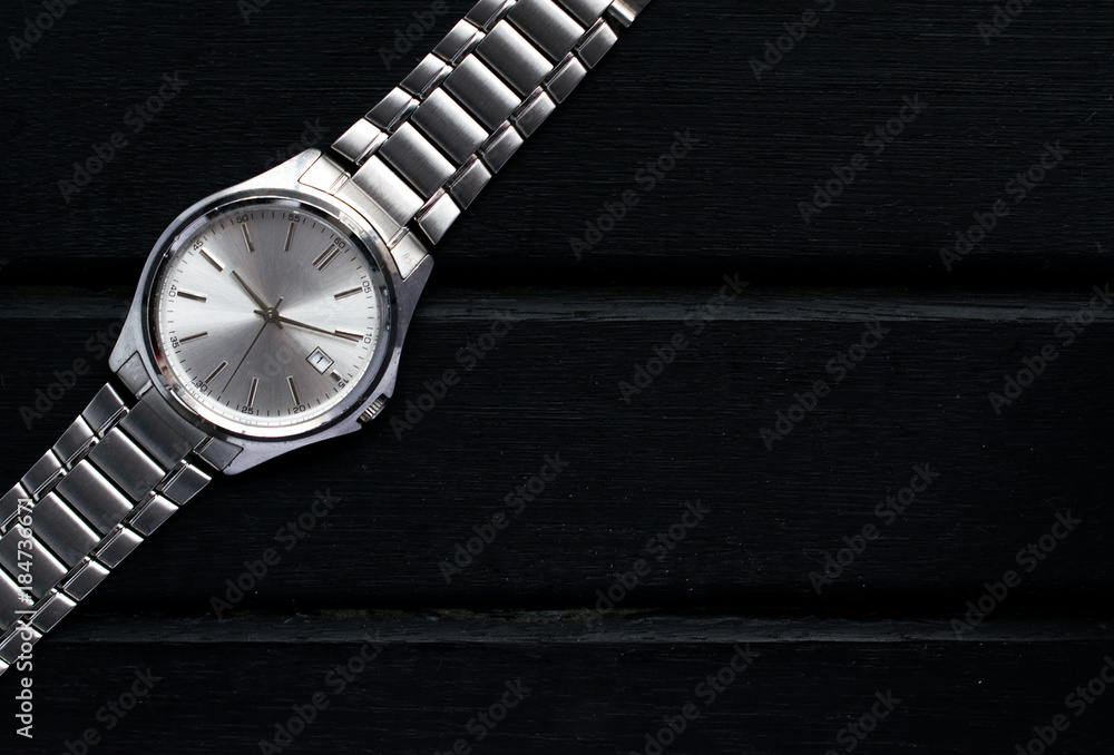 custom made wallpaper toronto digitalStainless steel silver mens wrist watch on a black wooden surface, with lots of copy space and contrast