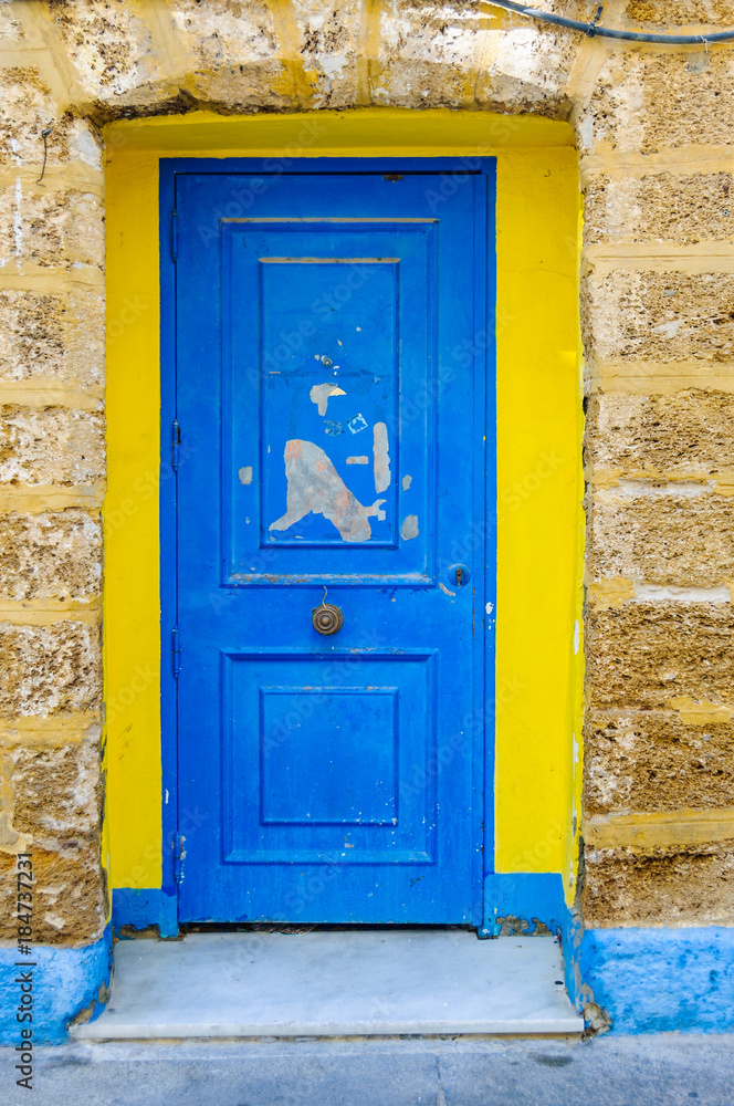 Yellow and blue door in Cadiz, Spain Yellow and blue door in Cadiz, Spain
