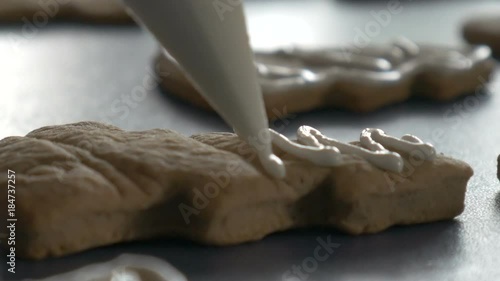 Christmas cookie is decorated with glaze, closeup dolly shot, ungraded photo
