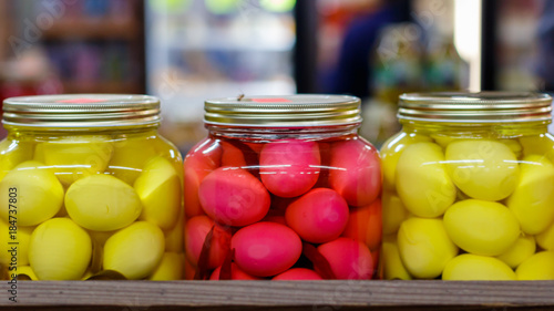 Jars of Yellow and Red Pickled Eggs