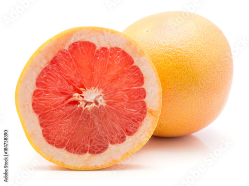 One red grapefruit ring slice and one whole isolated on white background.