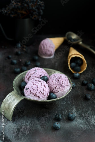blueberry ice cream in an old silver bowl and cones