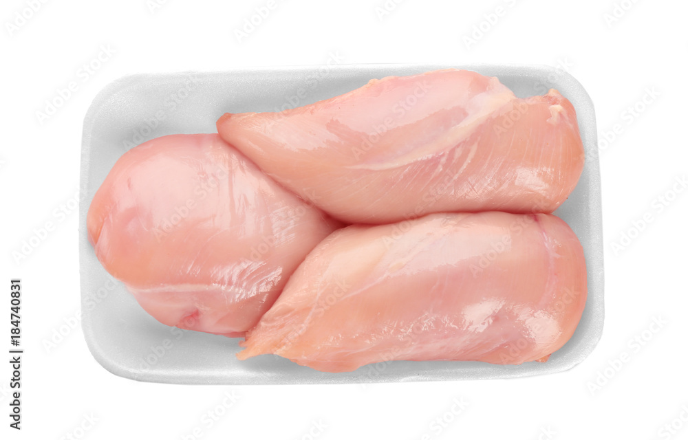 Container with raw chicken fillet on white background Container with raw chicken fillet on white background