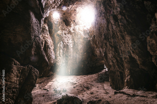 Sun lights droping in the middle of Cave