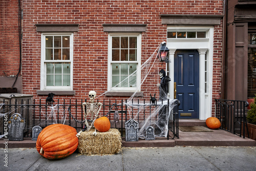 a brownstone building decorated for halloween