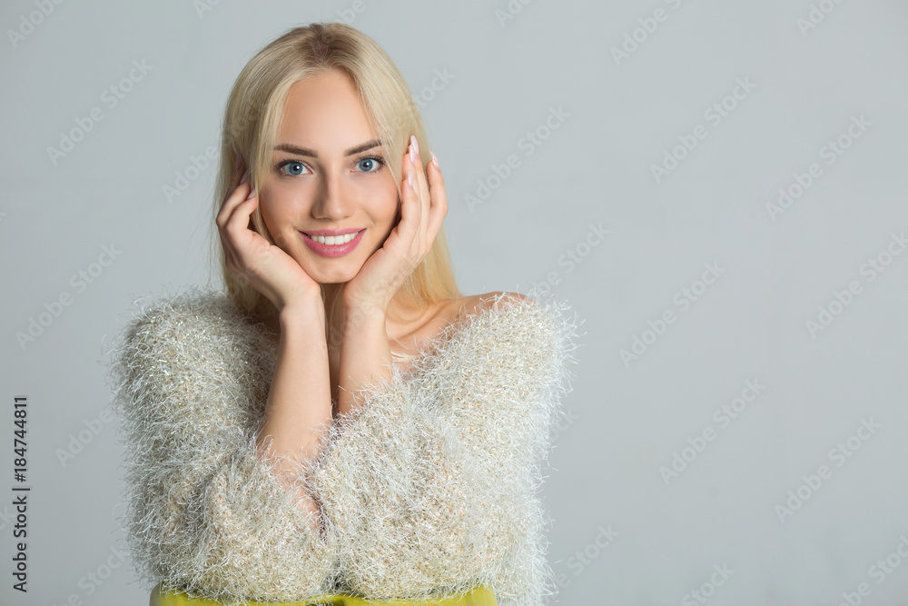 beautiful young stylish girl with a smile on a light background beautiful young stylish girl with a smile on a light background