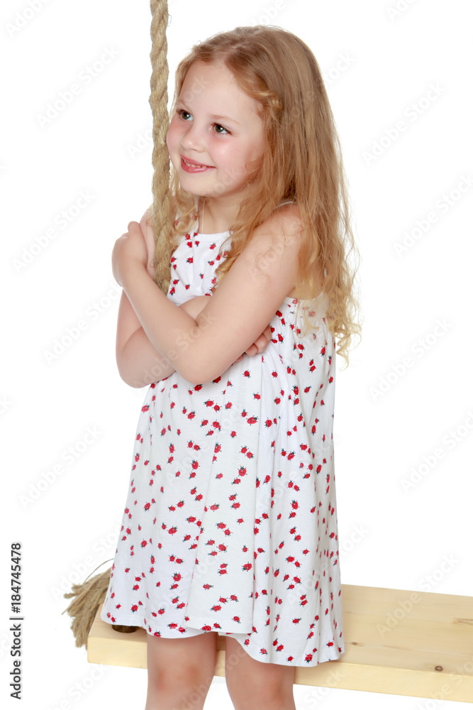 Little girl swinging on a swing Little girl swinging on a swing