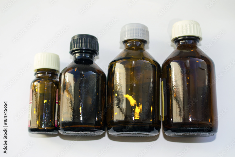 Small brown glass jars Small brown glass jars