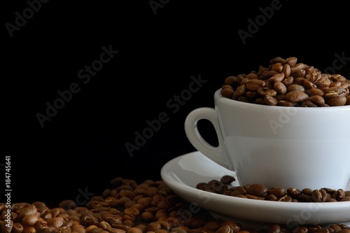Fresh Roasted Coffee Beans in the White Cup on Black Background