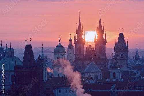Rising Sun behind the Prague Towers