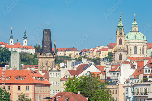 Lesser Town Bridge Towers and St. Nicholas Church at the Mala Strana in Prague, Czech Republic, in the morning
