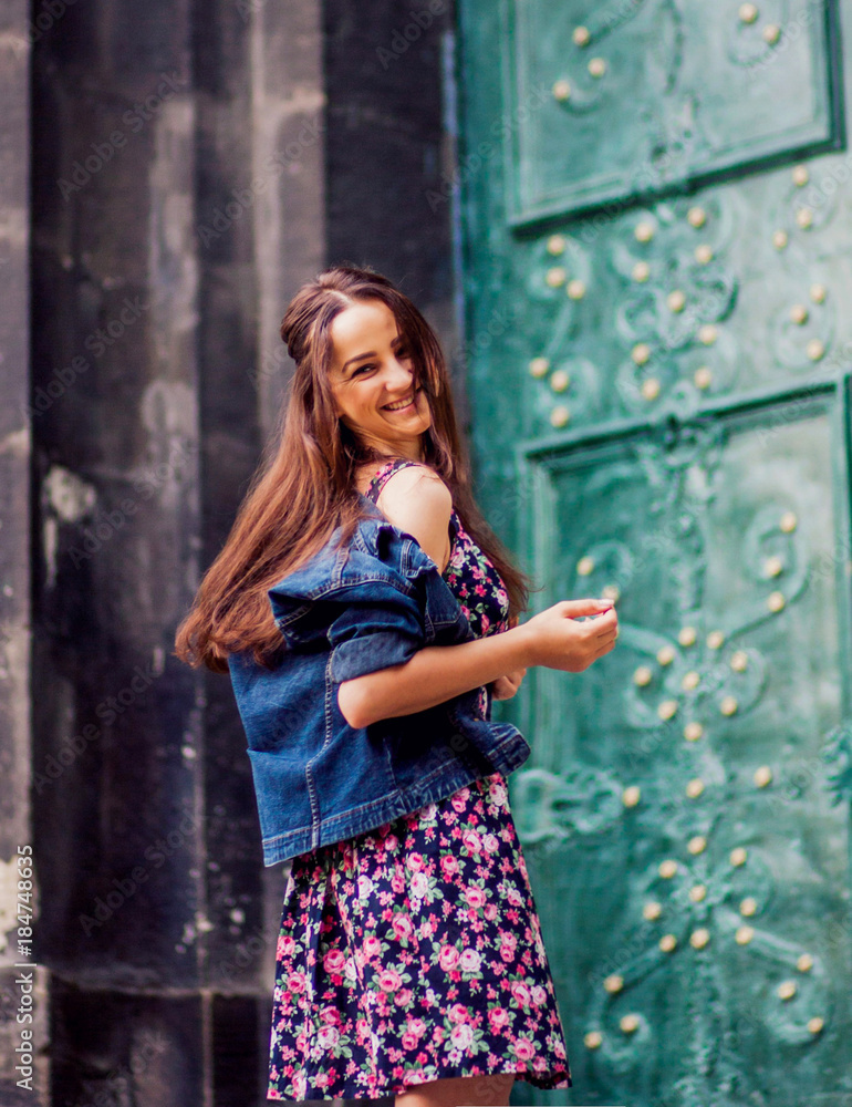Fototapeta premium Wonderful girl walking along the street