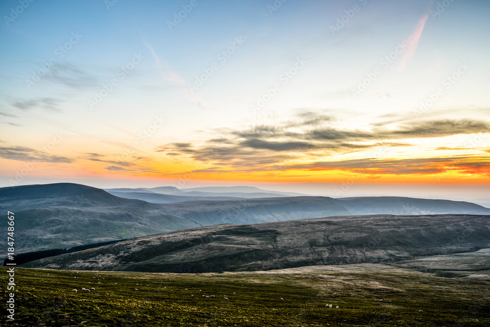 Sunset over Pen Y Fan, Mountain Range, Wales UK Sunset over Pen Y Fan, Mountain Range, Wales UK