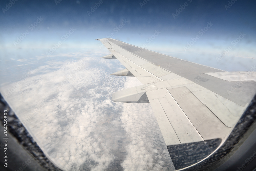 Obraz premium plane, blue, sky, nature, cloud, flight, horizon, window, beautiful, air, airplane, aircraft, white, light, glass, wing, outdoor, top, fly, high, earth, frame, view, cloudscape, travel, transport, bus
