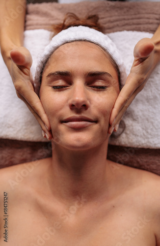 Beautiful woman getting a face massage