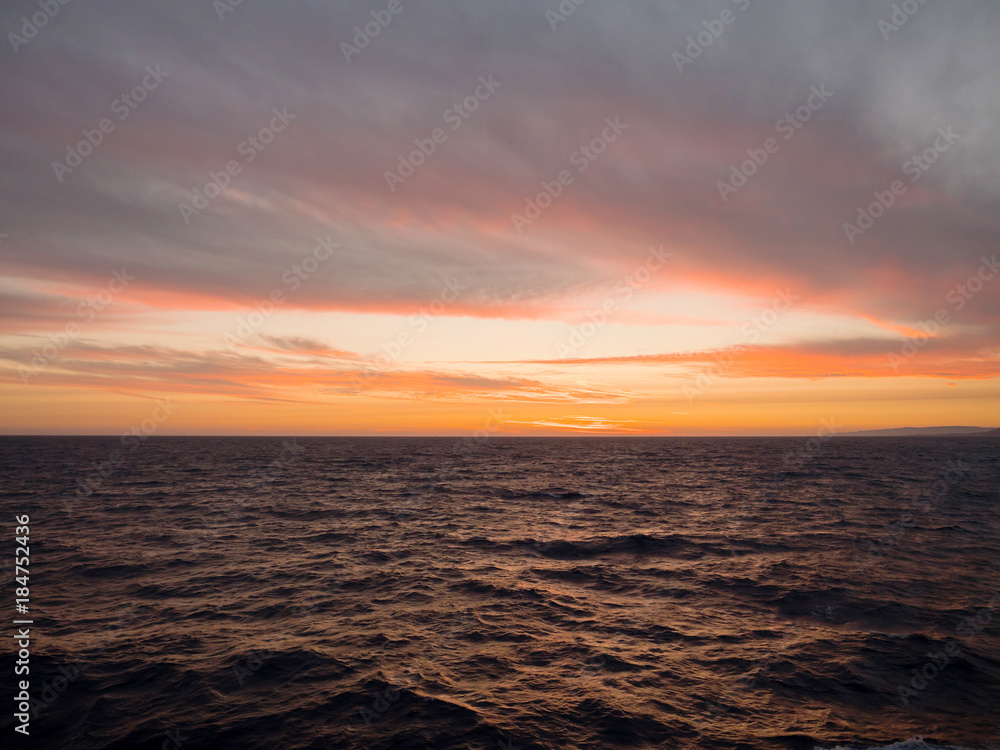 Beautiful sunset with clouds in the sea