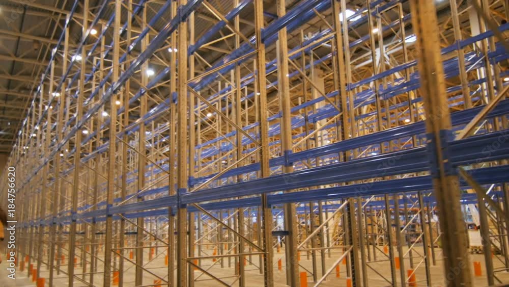 Camera Rotates between Racks in Building for Storing Goods Camera Rotates between Racks in Building for Storing Goods
