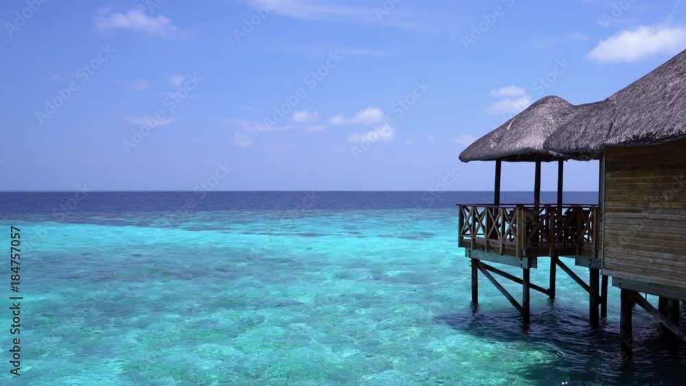 Tropical travel card with pristine beach and water bungalows at maldivian island Tropical travel card with pristine beach and water bungalows at maldivian island