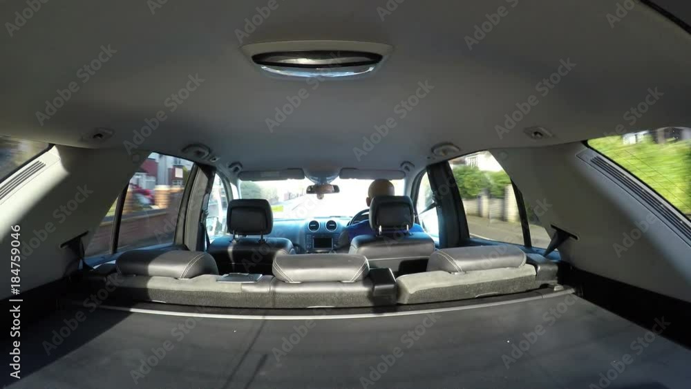 Man driving in his car during the daytime Man driving in his car during the daytime