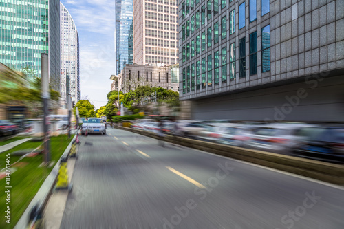 blurred asphalt road through modern city in China