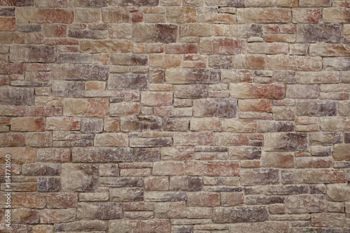 stone wall background of red-brown color.