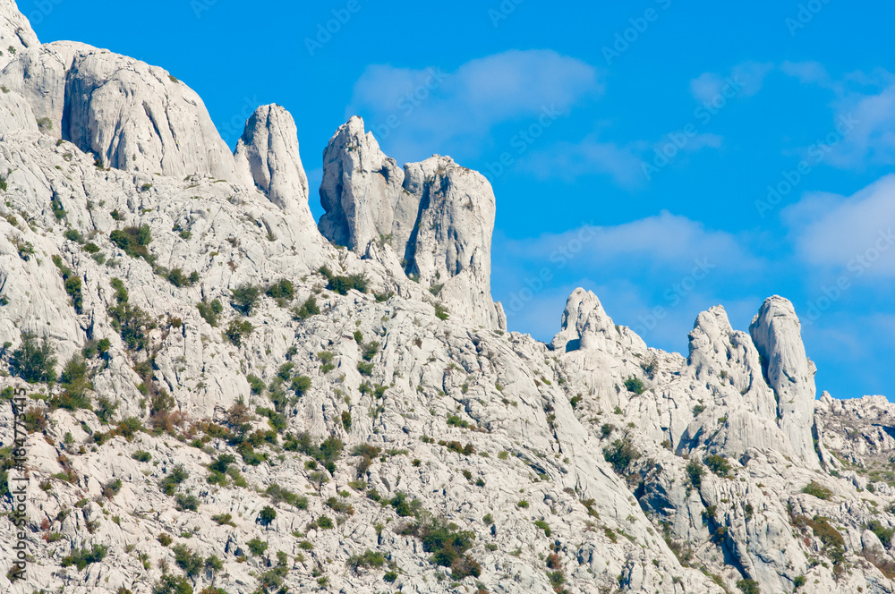 Adriatic coastal region in Dalmatia, Croatia with white, rocky mountains