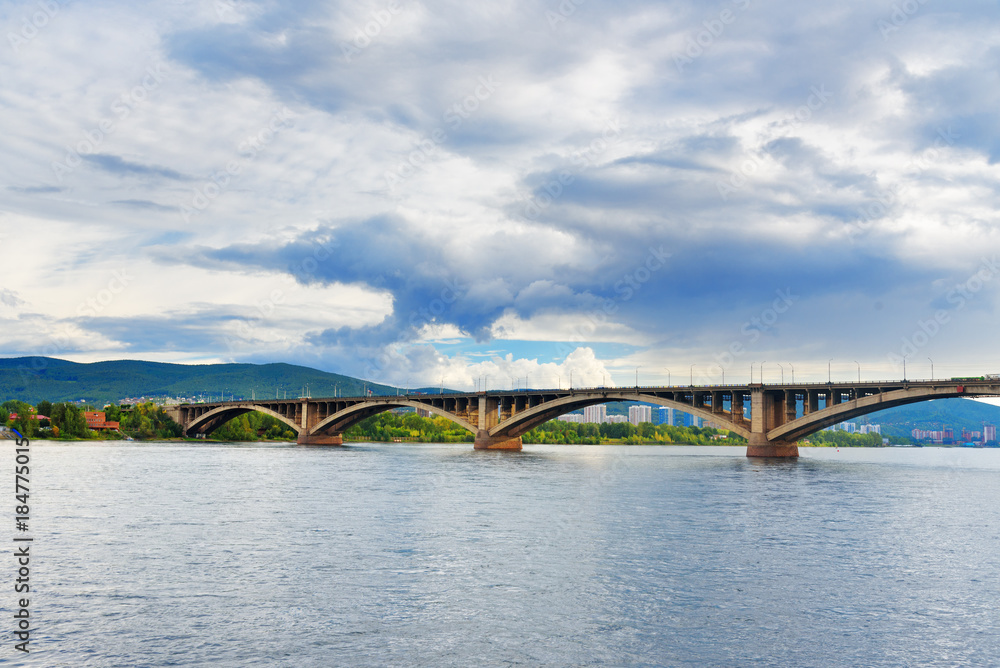 Fototapeta premium Communal bridge across the Yenisei river. Krasnoyarsk, Russia