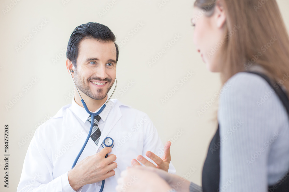 Doctor using stethoscope with attractive smiling. People with medical concept. Doctor using stethoscope with attractive smiling. People with medical concept.