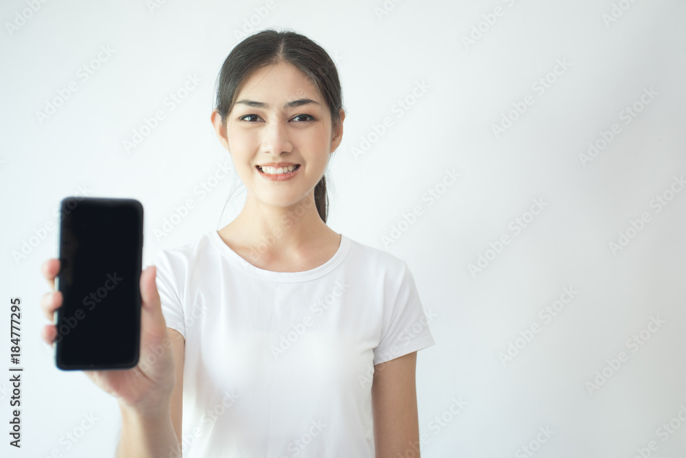 Portrait of Attractive Asian Woman using smartphone with smiling on white background. Portrait of Attractive Asian Woman using smartphone with smiling on white background.
