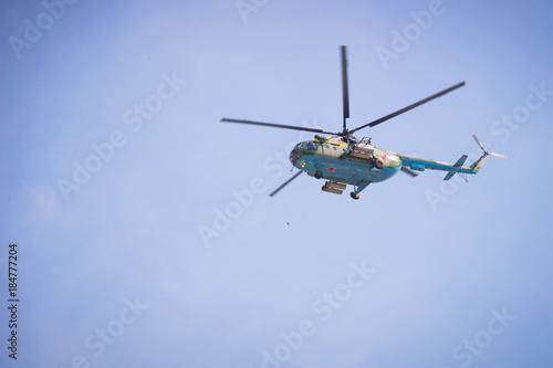 military helicopters flying in the blue sky