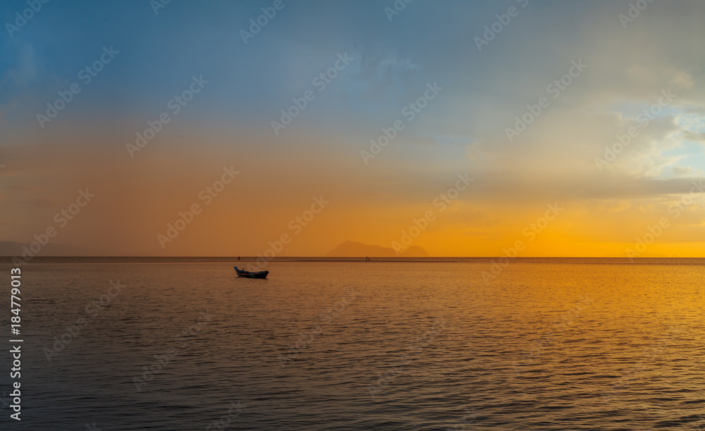 Fisherman boat with sunset scene in koh phangan. Horizontal image.