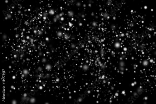 Abstract snowfall on black background © Kwangmoozaa