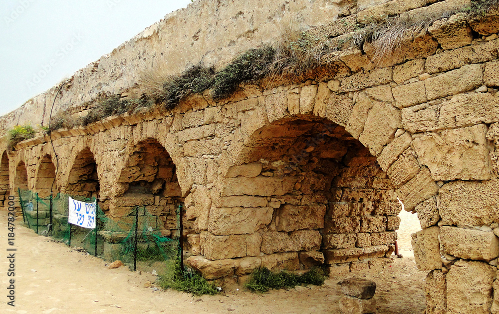 Roman ancient aqueduct near the Mediterranean Sea in Israel