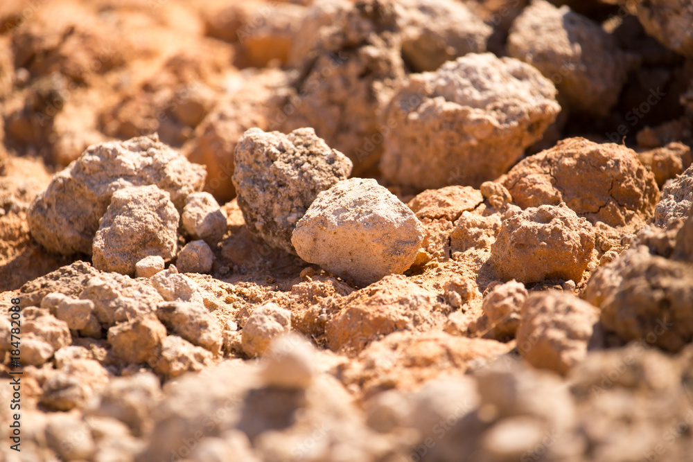 Red clay soil on nature as a background Red clay soil on nature as a background