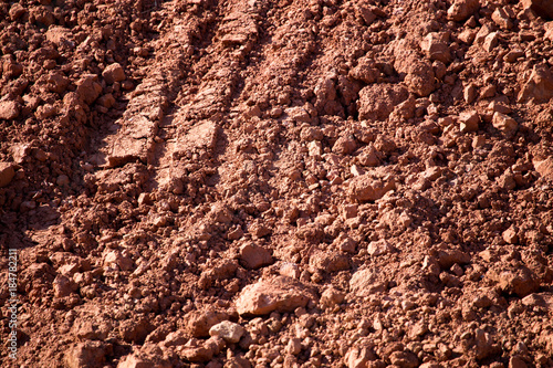 Red clay soil on nature as a background